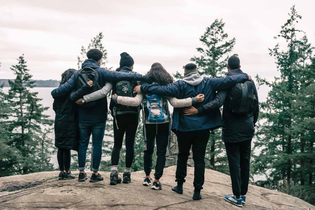 Group of hikers on a trail overlooking hills