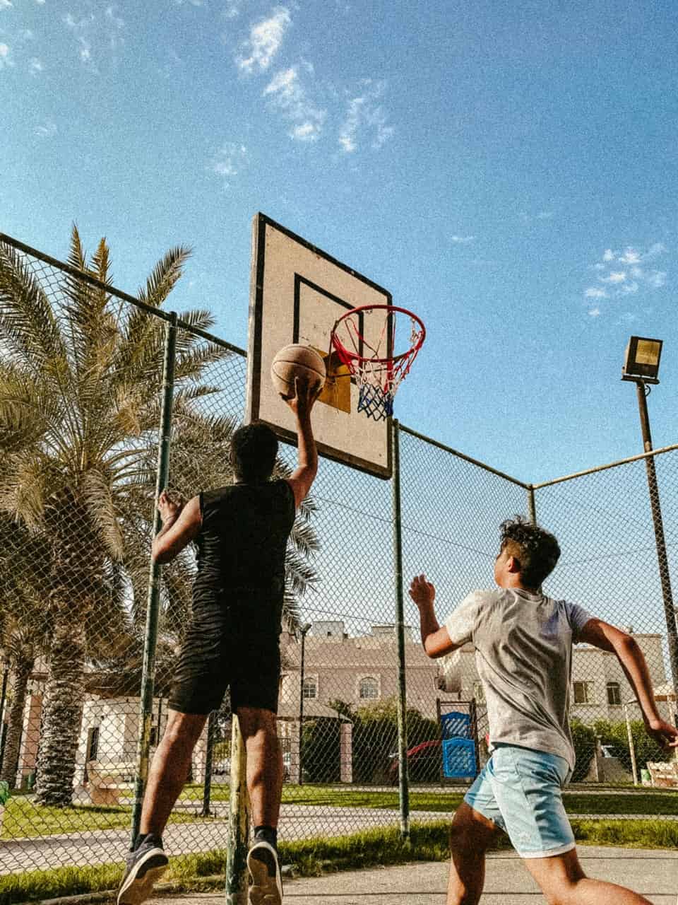 Outdoor street basketball game in progress